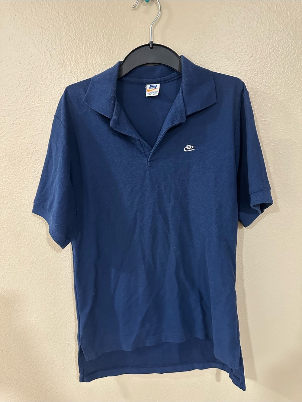 Vintage NIKE Men's Navy Blue Short-Sleeve Polo with White Swoosh